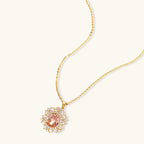 Ornate gold-plated jewelry set featuring peach center stone surrounded by clear AAA cubic zirconia crystals