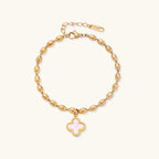 18K gold-plated oval bead bracelet with a four-leaf clover charm in mother-of-pearl or black enamel, adjustable lobster clasp, on white background.