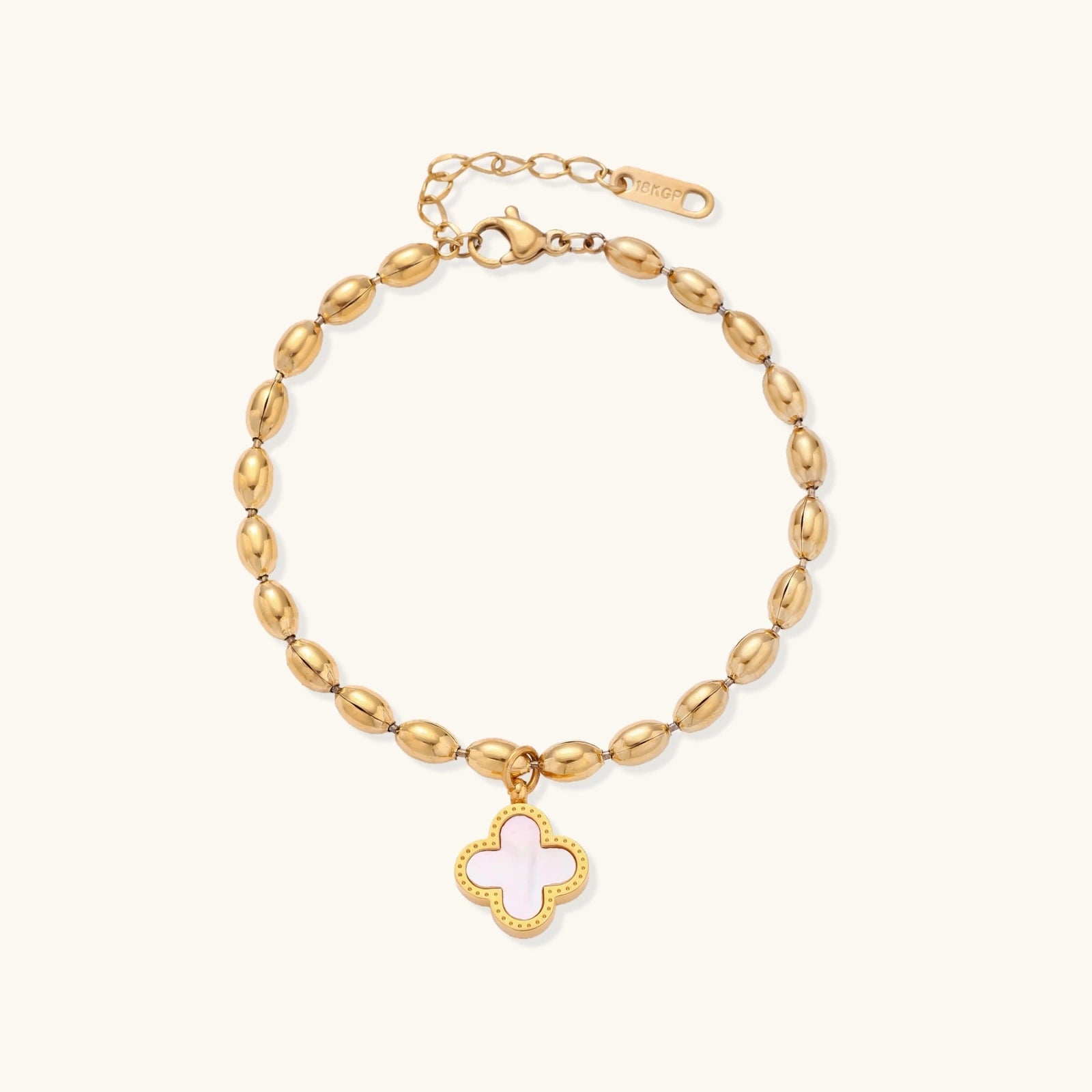 18K gold-plated oval bead bracelet with a four-leaf clover charm in mother-of-pearl or black enamel, adjustable lobster clasp, on white background.